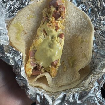 Tito's Tacos - Breakfast taco with Mexican sausage (GREEN HOT SAUCE) is the BOMB!!! - Tacos Near Me - Katy, Texas