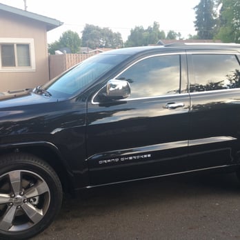 Street Image Wraps - My 2015 Jeep Grand Cherokee Overland. 30% fronts with a 5% sunstrip, currently stock on back. - Car Window Tinting Near Me - San Leandro, California Street Image Wraps - My 2015 Jeep Grand Cherokee Overland. 30% fronts with a 5% sunstrip, currently stock on back. - Car Window Tinting Near Me - San Leandro, California
