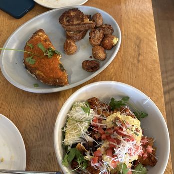 Wildseed - Chilaquiles with soyrizo (bottom) Spicy sausage omelet (top) - Vegan Near Me - San Francisco, California Wildseed - Chilaquiles with soyrizo (bottom) Spicy sausage omelet (top) - Vegan Near Me - San Francisco, California