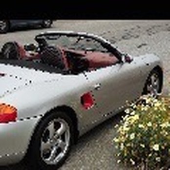 Pro Auto Stereo Installation - Porsche Boxster by a flowering bush - Car Stereo Installation Near Me - San Mateo, California