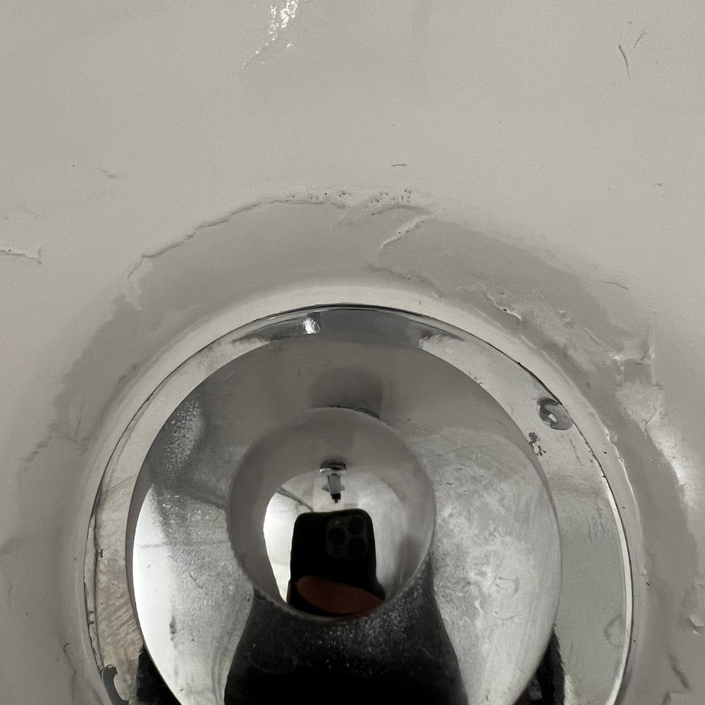 Poor prep work around tub drain. Poor prep work around tub drain.