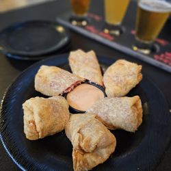 7 West TapHouse - TAPHOUSE ROLLS - Reuben Rolls: Corned beef, swiss cheese, sauerkraut. Served with TapHouse sauce....very delicious!!