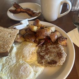 Wheat toast,over easy eggs,great sausage and potatoes. Also side order of bacon. Wheat toast,over easy eggs,great sausage and potatoes. Also side order of bacon.