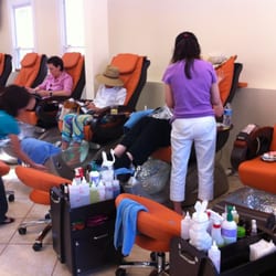 The Nails Spa - The Owner Christine in the purple shirt and white capris.