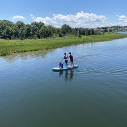 Three-person paddle board at Bass River Kayaks and Paddle Boards