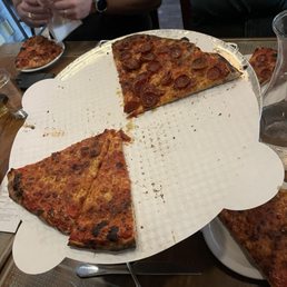 New haven't style pizza half pepp half cheese New haven't style pizza half pepp half cheese