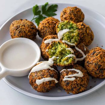 Nour Cafe - Falafel side with Tahini sauce, it comes in Pita bread in a wrap, plate or side order. - Falafel Near Me - Revere, Massachusetts Nour Cafe - Falafel side with Tahini sauce, it comes in Pita bread in a wrap, plate or side order. - Falafel Near Me - Revere, Massachusetts