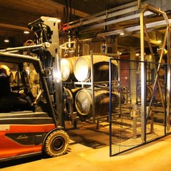 Viña Real - Forklift delivers 4 barrels to the racking machine at the start of the racking process.
