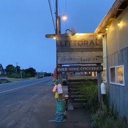 a street corner with a sign and a fire hydrant a street corner with a sign and a fire hydrant