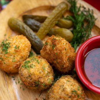McPutins - Truffle Kiev Bites with a side of Pickles - Russian Near Me McPutins - Truffle Kiev Bites with a side of Pickles - Russian Near Me
