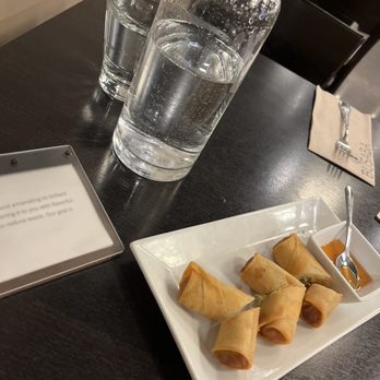 Busaba - a plate of food and a glass of water - Thai Near Me - Erie, Colorado