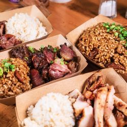 From top left corner clockwise: Smoked Pork Bowl, Smoked Fried Rice, Smoked Boneless Chicken, and our Smoked Kalbi Bowl.