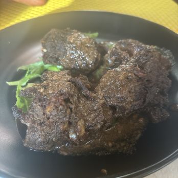 Afrodisiac - The famous jerk turkey necks as an appetizer. You can order as a meal with three sides. - Caribbean Near Me - New Orleans, Louisiana Afrodisiac - The famous jerk turkey necks as an appetizer. You can order as a meal with three sides. - Caribbean Near Me - New Orleans, Louisiana