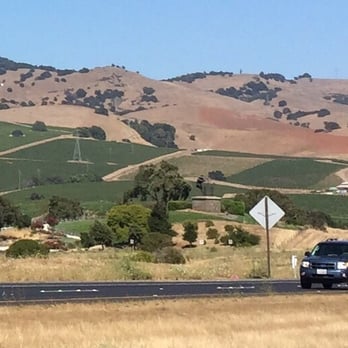 Grape Crusher Statue - Grape Crusher Statue as seen heading South via Highway 29; Meritage/Vino Bello Hiking Trail is hidden. - Landmarks & Historical Buildings Near Me - Napa, California