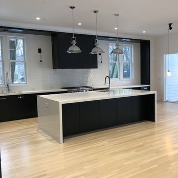 CGL Flooring - a kitchen with a center island - Flooring Near Me CGL Flooring - a kitchen with a center island - Flooring Near Me