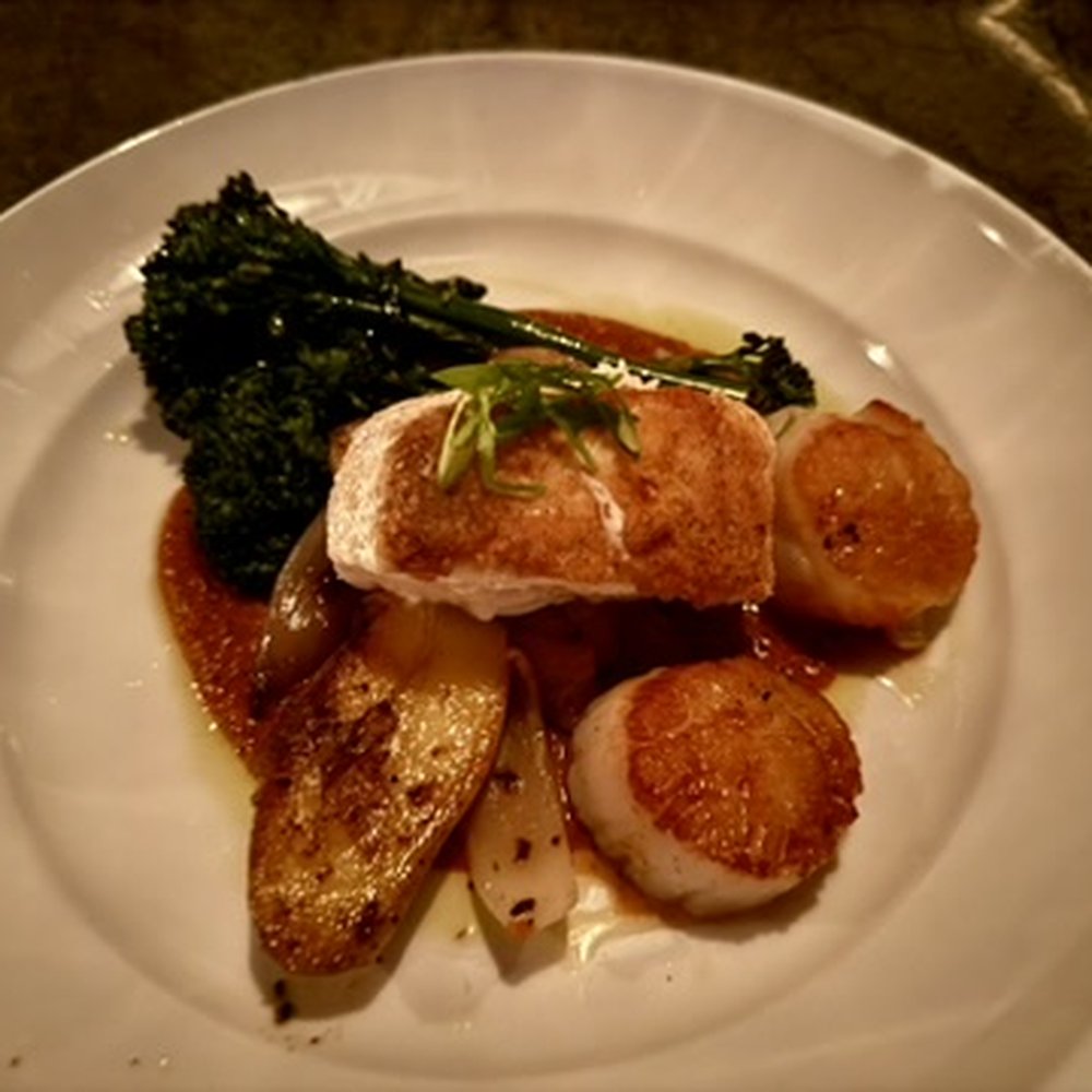 The Cellar at Duckworth's - Halibut, two seared scallops done perfectly, broccolini, puttanesca sauce. - Gastropubs Near Me - Charlotte, North Carolina The Cellar at Duckworth's - Halibut, two seared scallops done perfectly, broccolini, puttanesca sauce. - Gastropubs Near Me - Charlotte, North Carolina