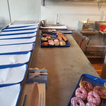 Paradise Donuts - donuts lined up on a counter - Donuts Near Me - Wichita, Kansas Paradise Donuts - donuts lined up on a counter - Donuts Near Me - Wichita, Kansas