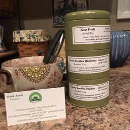 three tins with labels on them