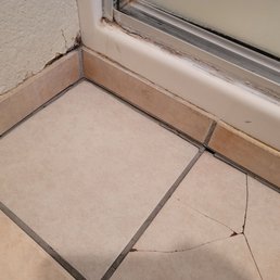 Loose bathroom tiles, subfloor deteriorated below