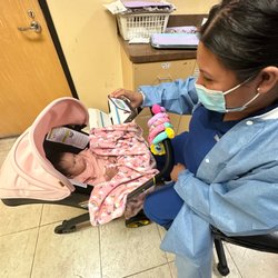 Parvaz Farnad Mizrahi, DDS - The lovely nurse entertaining my babygirl during my wisdom tooth extraction :)