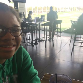 Topgolf - Bar and extra seating overlooks course - Golf Near Me - Houston, Texas