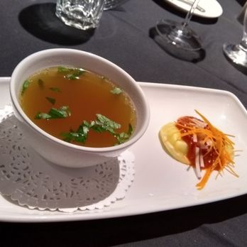 Restaurant International - Beef consomme with goat cheese ravioli. Consomme a bit bland, but ravioli was good. - Canadian (New) Near Me - Ottawa, Ontario