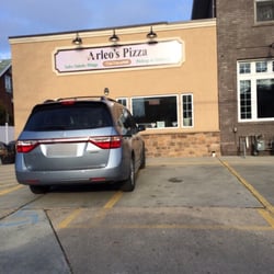 The exterior of Arleo's Pizza. It is smaller on the inside.