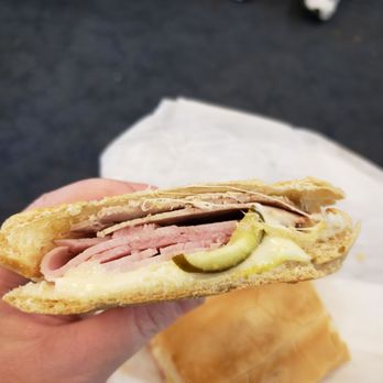 La Carreta Restaurant - a person holding a sandwich - Cuban Near Me - Miami, Florida La Carreta Restaurant - a person holding a sandwich - Cuban Near Me - Miami, Florida