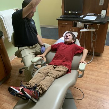 Underdog Custom Mouthguards - Dr. Lirio fitting his new mouthguard. In New England Patriot colors! - Sporting Goods Near Me - Sarasota, Florida Underdog Custom Mouthguards - Dr. Lirio fitting his new mouthguard. In New England Patriot colors! - Sporting Goods Near Me - Sarasota, Florida