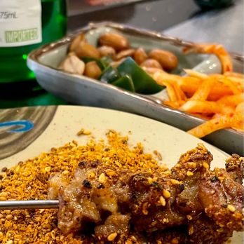 Ming Xing BBQ - a plate of food and a bottle of beer - Barbeque Near Me - Flushing, New York