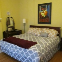 Tyler Adams House - Room #6 is spacious and bright with a large closet, an ornamental fireplace, a flat screen TV, a separate private study, and a private bath.