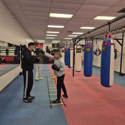 Warzone Boxing Club - Assisting in the proper techniques  and the fundamentals of boxing.