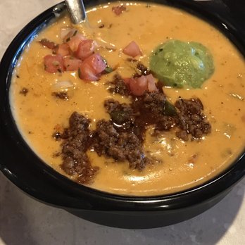 Chuy's - Quest Compuesto - Chile con queso with seasoned ground sirloin, guacamole, and pico de gallo - Tex-Mex Near Me - Jacksonville, Florida