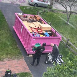 Home Team Moving - Home Team Movers filling a dumpster in our driveway.