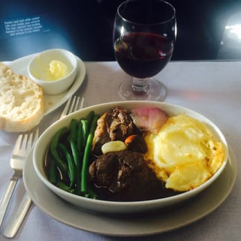 SAS Scandinavian Airlines - 3rd: Venison cheeks braised in wine with browned garlic, shallots,  crisp beans and a pommes gratin-  w/ a Pinot Noir  Amazingly luscious. - Airlines Near Me - Kastrup, 84