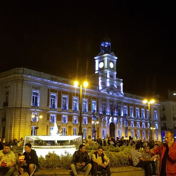 La Puerta del Sol - Real Casa de Correos at night - Local Flavor Near Me - Madrid, M