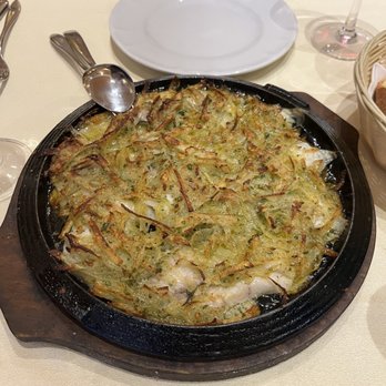 Settembrini 18 - Sea bass encrusted with potatoes and cooked in the wood fired pizza oven. - Italian Near Me - Milan, Michigan Settembrini 18 - Sea bass encrusted with potatoes and cooked in the wood fired pizza oven. - Italian Near Me - Milan, Michigan
