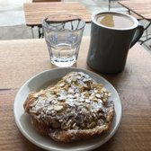 Photo of Streamline - San Francisco, CA, United States. Almond Croissant (featuring water and americano)