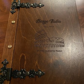 Borgo Italia - a wooden table with a menu on it - Pizza Near Me - Senoia, Georgia