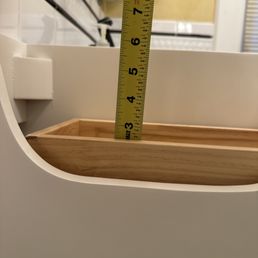 Decors US - measuring the side of the drawer because it needs to be shorter to accommodate the sink - Kitchen & Bath Near Me - Paramus, New Jersey