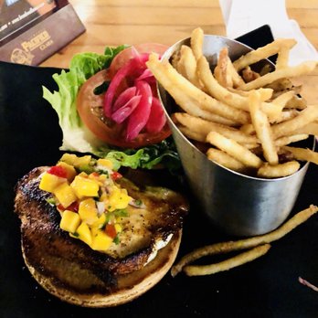 Down the Hatch Maui - Fish sandwich with mango salsa and shoestring fries. - Seafood Near Me - Lahaina, Hawaii Down the Hatch Maui - Fish sandwich with mango salsa and shoestring fries. - Seafood Near Me - Lahaina, Hawaii