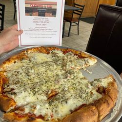 J T's Pizza & Subs - Large sausage and mushroom pizza.