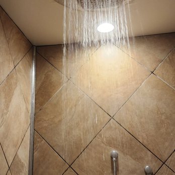 Newell Station - a shower head in a tiled bathroom - Grocery Near Me - Newton, Kansas Newell Station - a shower head in a tiled bathroom - Grocery Near Me - Newton, Kansas