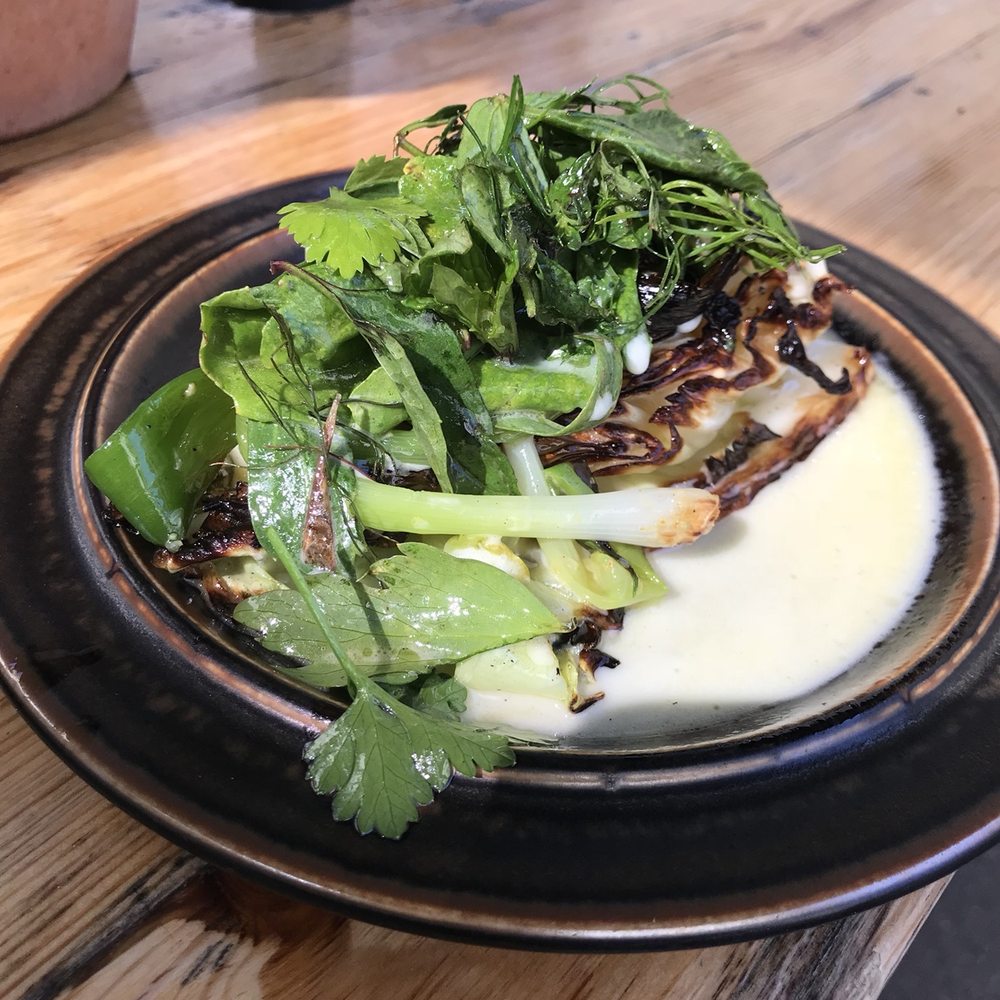Manfreds - Roasted cabbage with spring onions and herb salad - Scandinavian Near Me - København N, 84 Manfreds - Roasted cabbage with spring onions and herb salad - Scandinavian Near Me - København N, 84