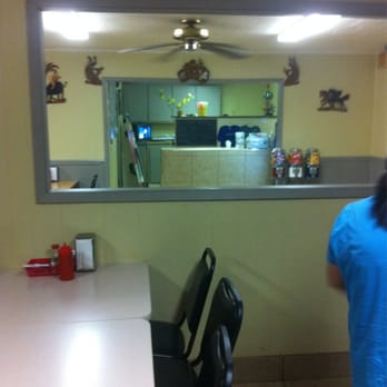 Mama's Kitchen - a woman in a blue shirt - Soul Food Near Me - Cut Off, Louisiana