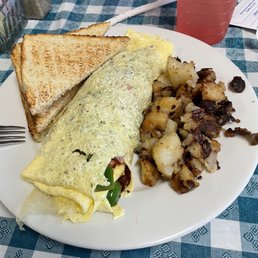 an omelet and potatoes on a plate