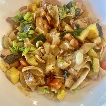 Taste Community Restaurant - Drunken Noodles Marinated chicken, rice noodles, bell peppers, zucchini, a spicy chili sauce and topped with fresh herbs, green onions - New American Near Me - Fort Worth, Texas Taste Community Restaurant - Drunken Noodles Marinated chicken, rice noodles, bell peppers, zucchini, a spicy chili sauce and topped with fresh herbs, green onions - New American Near Me - Fort Worth, Texas