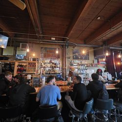 Fat Stan's Sports Bar & Pizzeria - Bunch a guys enjoy yhe local flavor and a pie