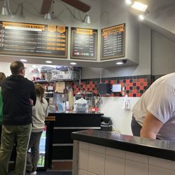 Izzy’s Burgers and Shakes - Standing in line looking at the order/pick up counter.