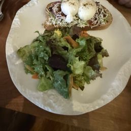 Avocado toast with 2 poached eggs and a small salad. Delicious Avocado toast with 2 poached eggs and a small salad. Delicious